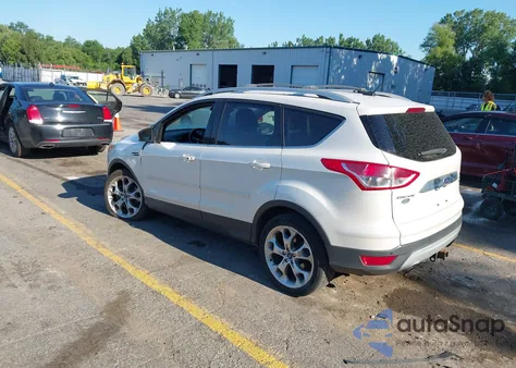 2014 Ford Escape Titanium z USA, uszkodzony, nr VIN 1FMCU0J97EUD79587